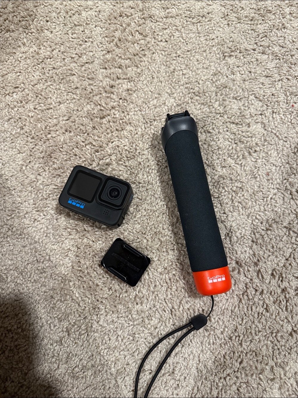 GoPro Action Camera with Black and Orange Floating Handle